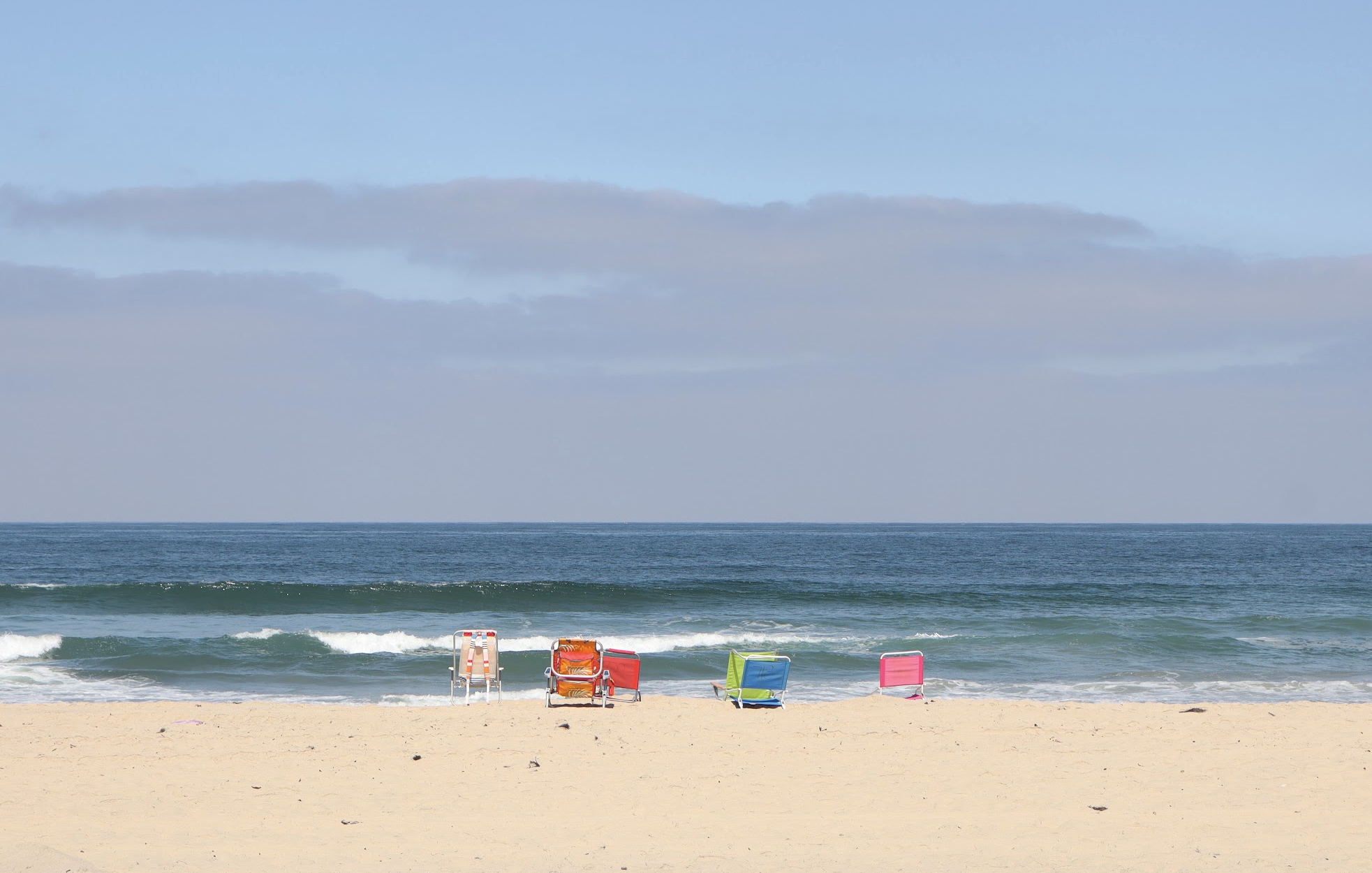 sun peaking over horizon of earth in space